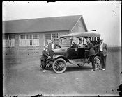 Group of people around a car